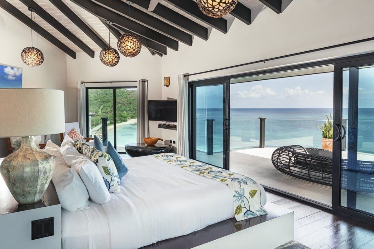 Bedroom opening to a sea-view terrace at Sunlight Breeze, Antigua