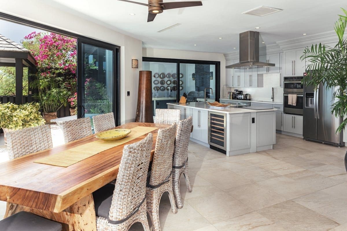 Dining table beside the kitchen opening to the sea at Sunlight Breeze, Antigua