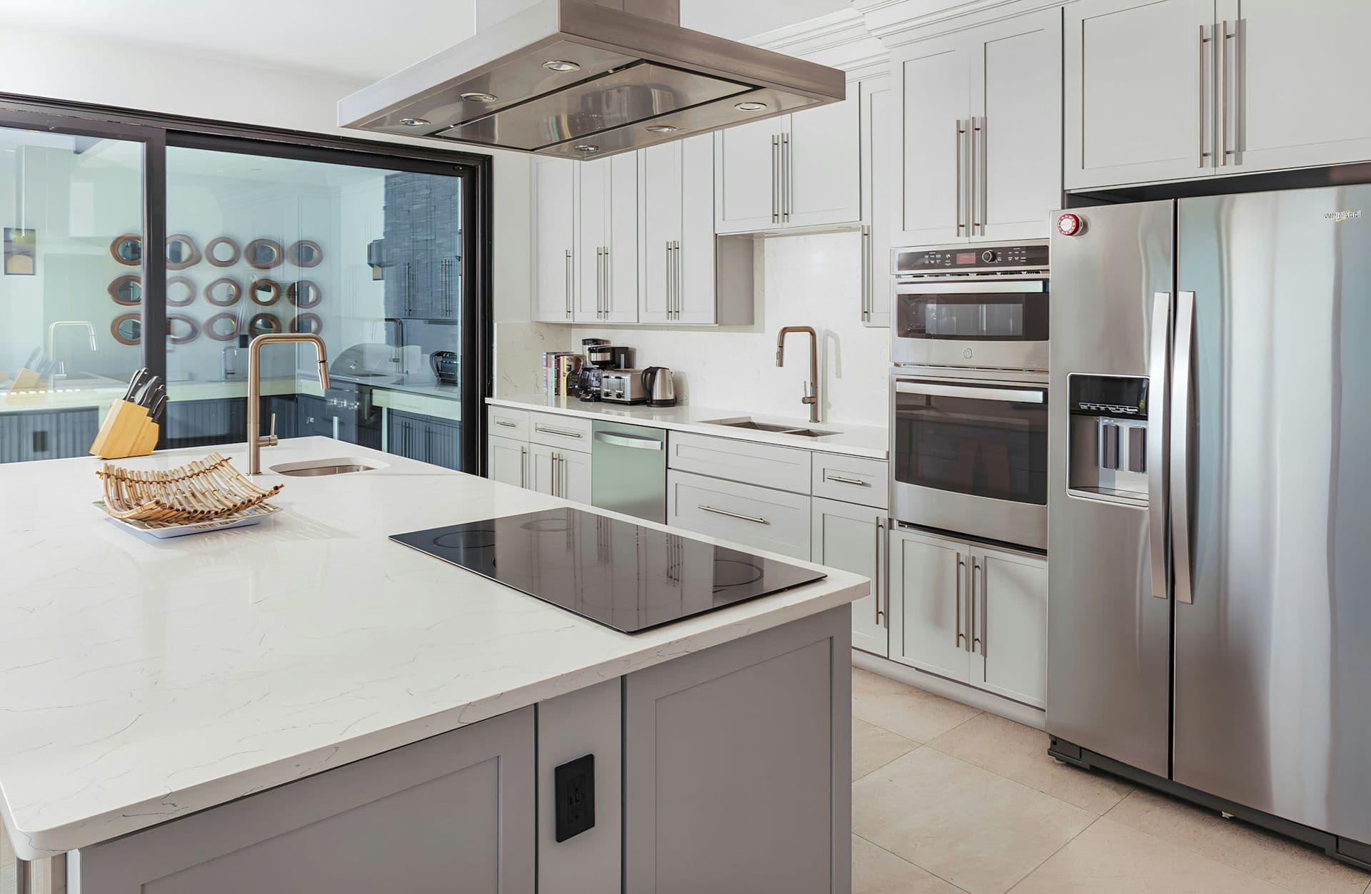 White kitchen with an island at Sunlight Breeze, Antigua
