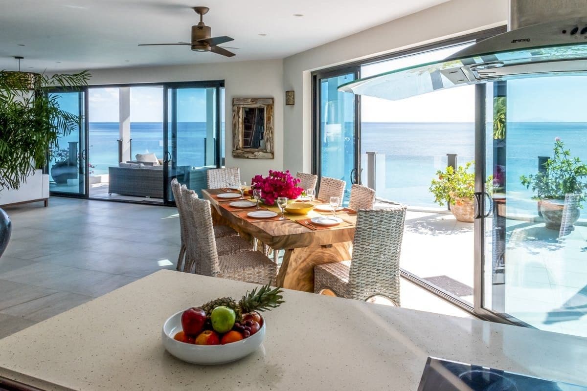 Open-plan living and dining opening to the pool terrace at Sunlight Breeze, Antigua