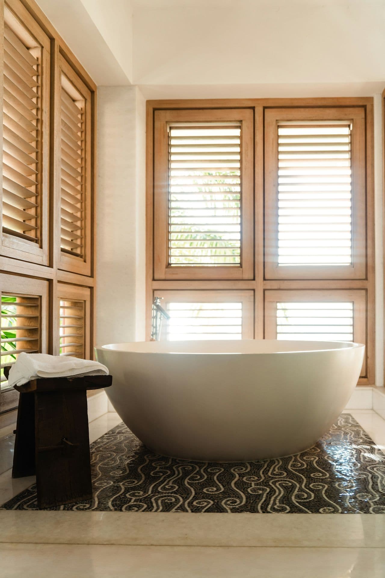 Bathroom with a freestanding bath and timber shutters at Moonlight Beauty, Barbados
