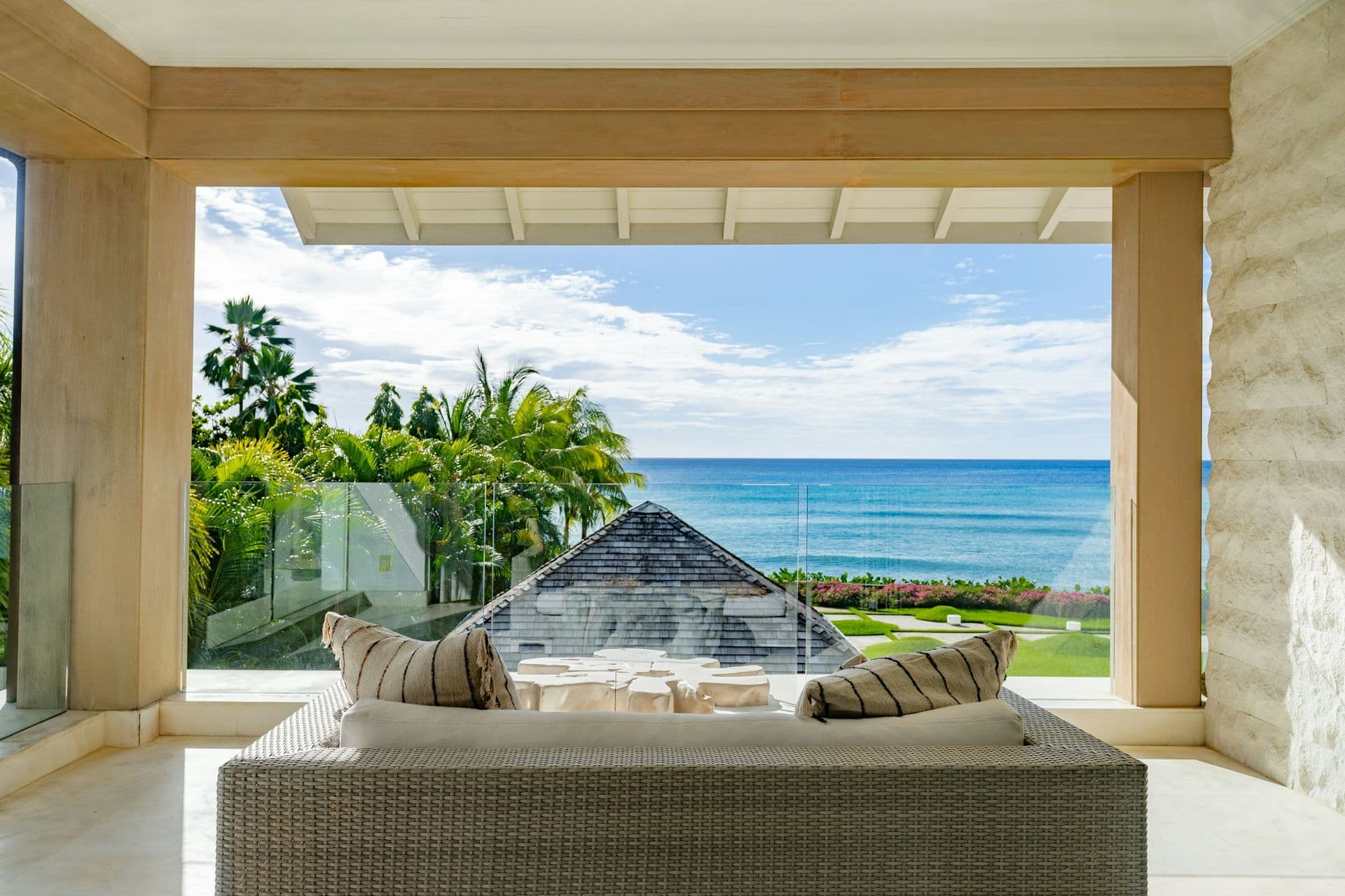 Bedroom opening to a private terrace with a daybed and sea view at Moonlight Beauty, Barbados