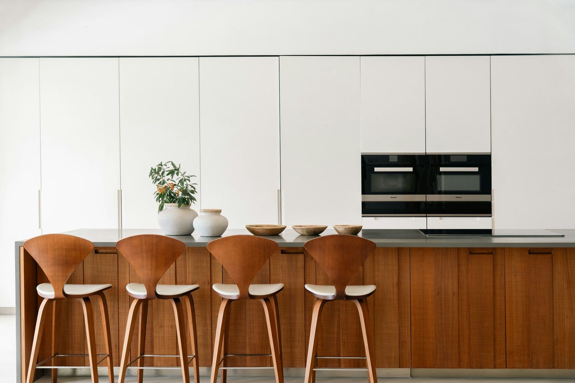 Timber chef's kitchen with an island and bar stools at Moonlight Beauty, Barbados