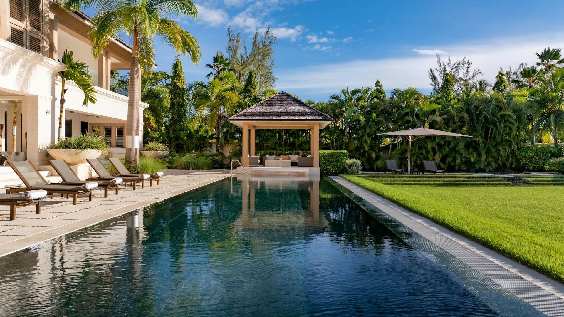 Swimming pool with a shaded gazebo and loungers at Moonlight Beauty, Barbados