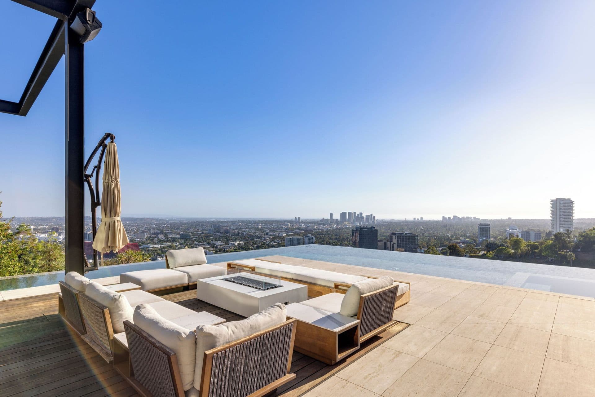 Rooftop terrace lounge with sweeping panoramic views over the Los Angeles skyline