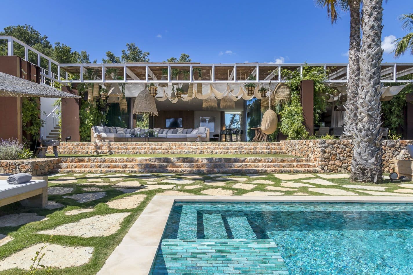Pool set into stone-walled garden terraces below the villa at Aphrodite's Oasis, Ibiza