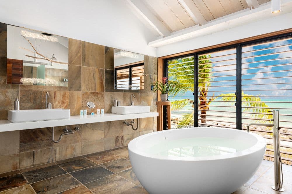 Master en-suite with a round freestanding tub facing the ocean at Silver Sands