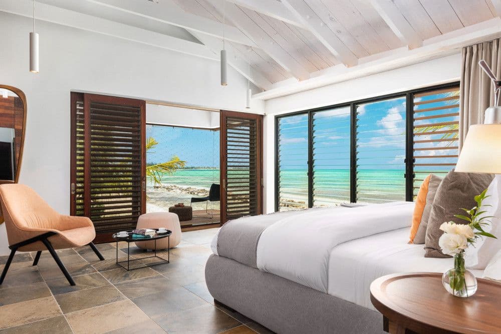 Master bedroom opening to a terrace right on the water at Silver Sands