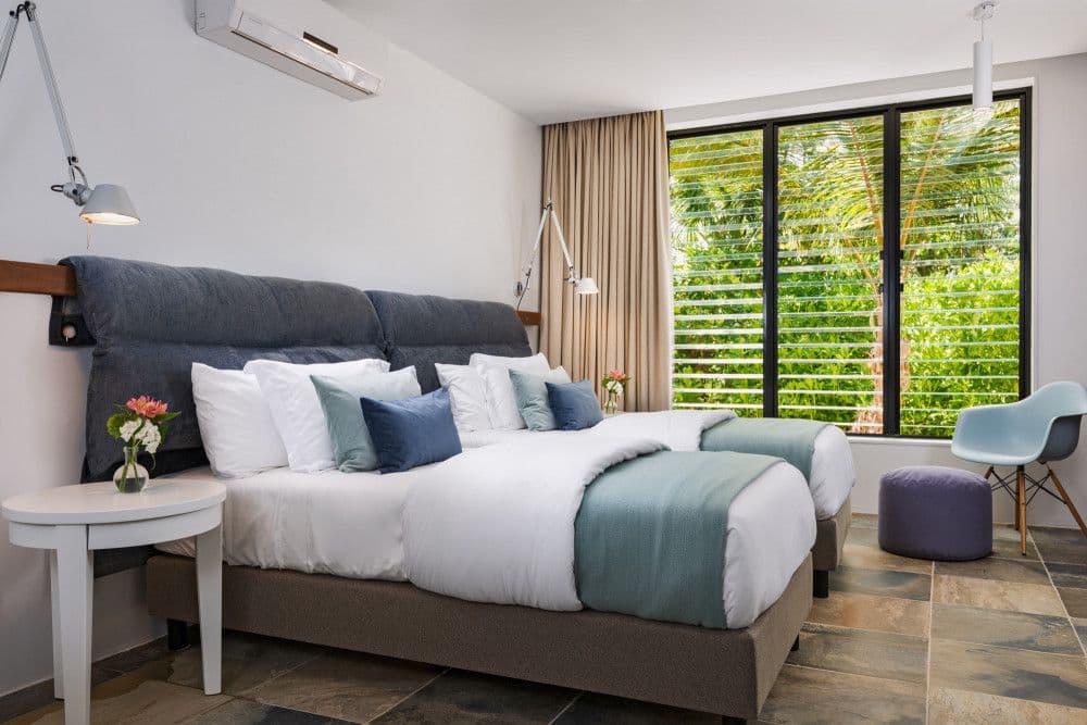 Twin bedroom with garden views at Silver Sands