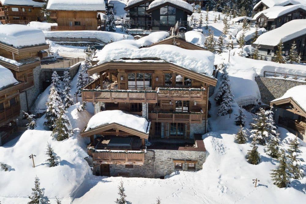 Aerial view of snow-covered chalets in Courchevel 1850