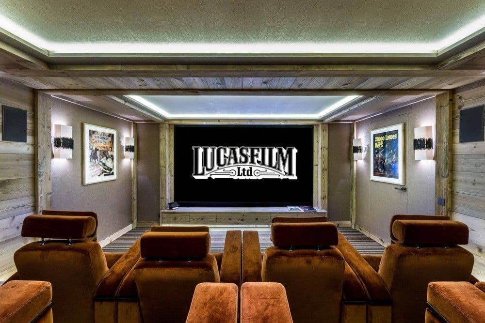 Home cinema with tiered leather seating at Courchevel 16