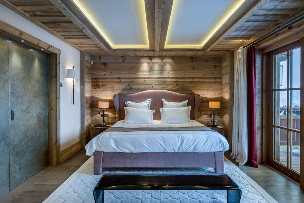 Master bedroom paned in old timber at Courchevel 16