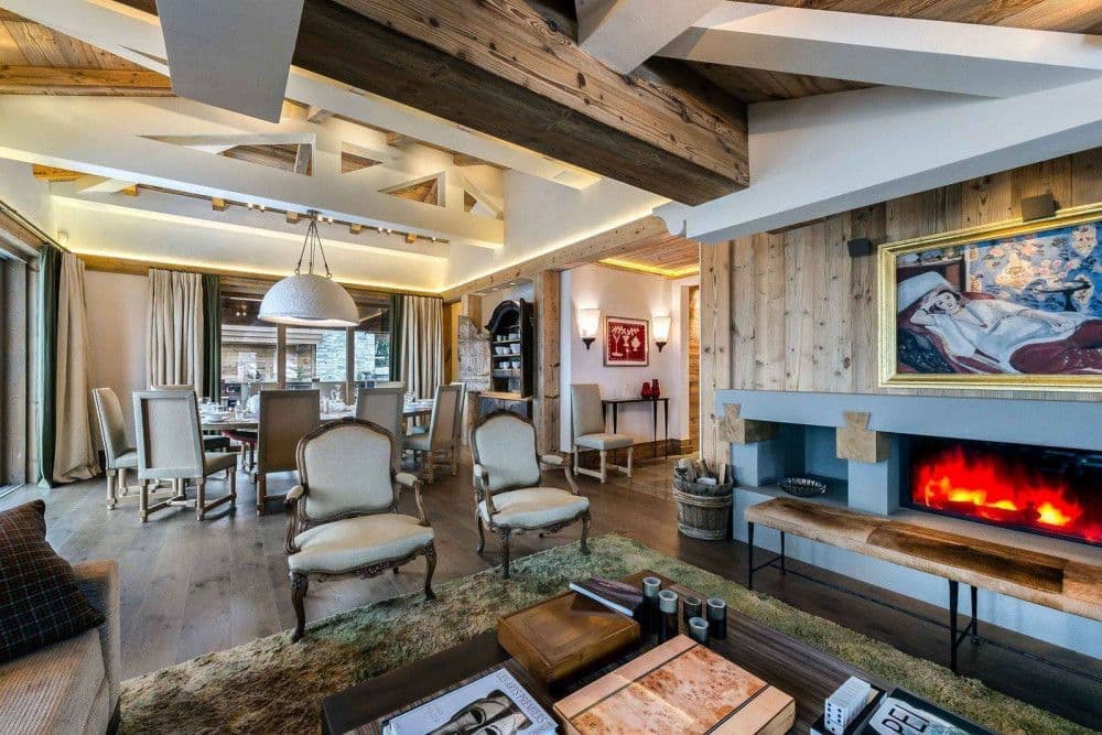 Fireside sitting room with antique chairs at Courchevel 16