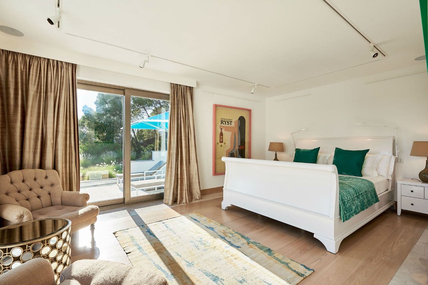 Guest bedroom with gold curtains and garden views at Somewhere On The Horizon