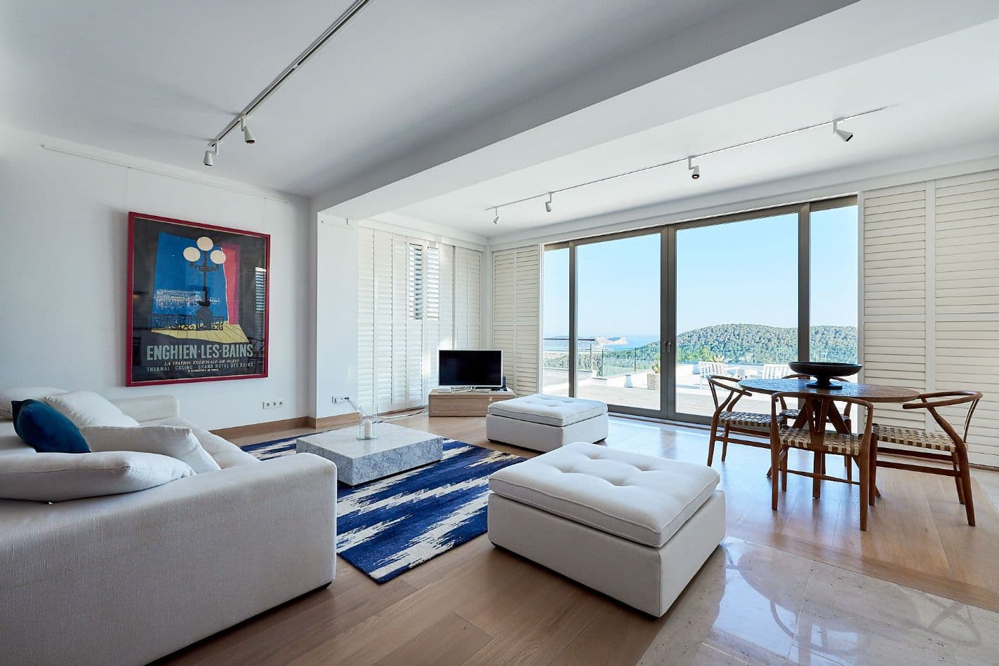 Second lounge with white sofas and blue ikat rug at Somewhere On The Horizon