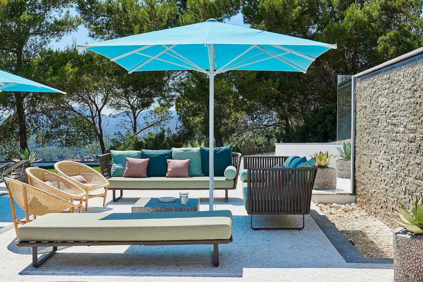 Poolside terrace lounge seating with parasol at Somewhere On The Horizon