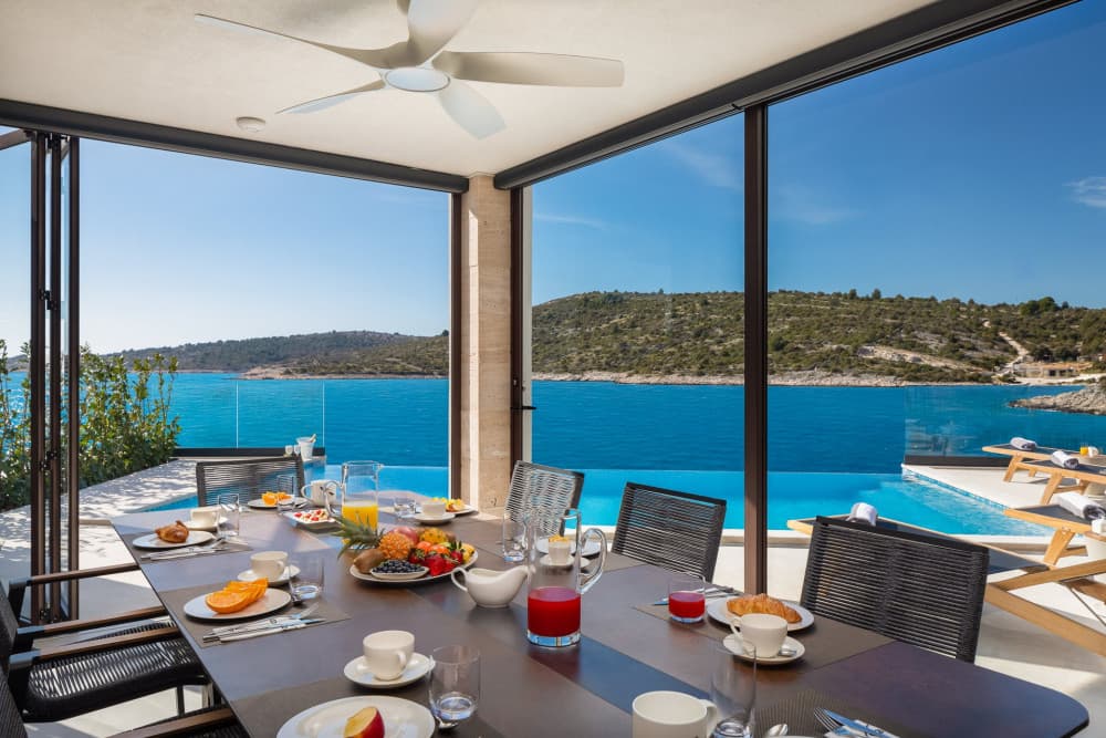 Rogoznica 6 outdoor dining area with travertine walls and sea views, Rogoznica, Croatia
