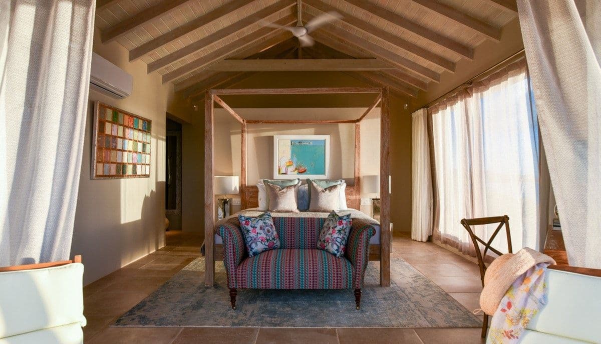 Four-poster master bedroom with canopy at Sea Breeze Cove