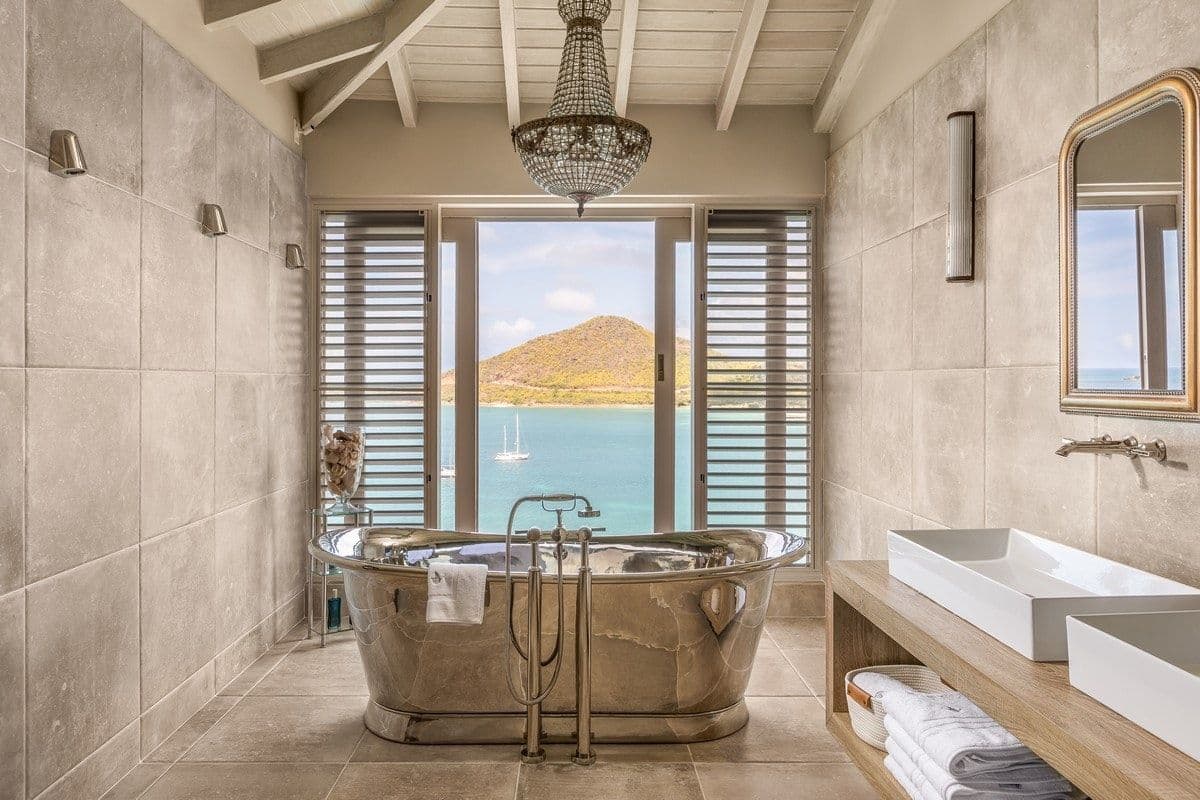 Silver slipper bath set before a sea view at Sea Breeze Cove