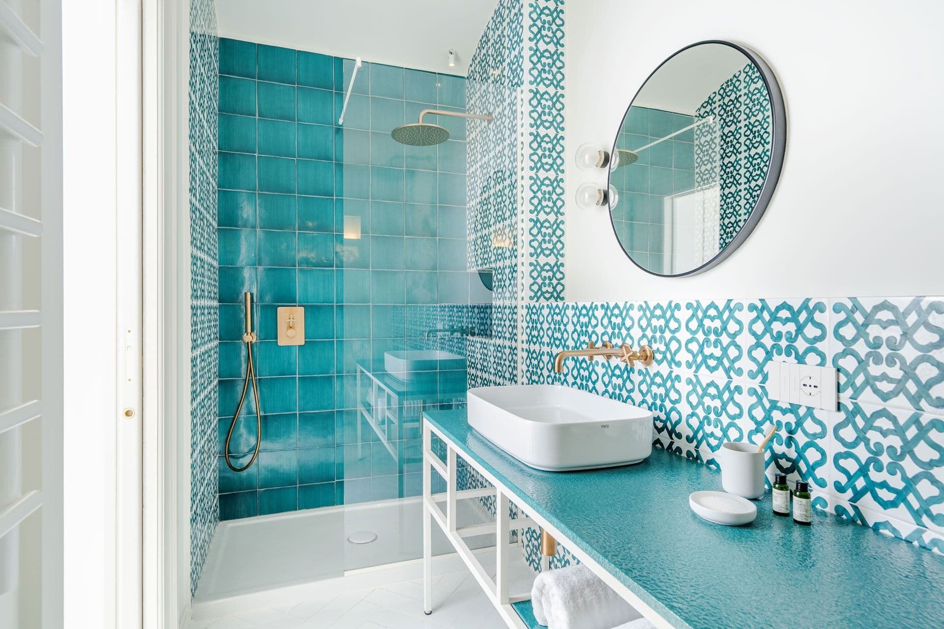 Bathroom with teal patterned tiles and walk-in shower at Ocean House, Positano