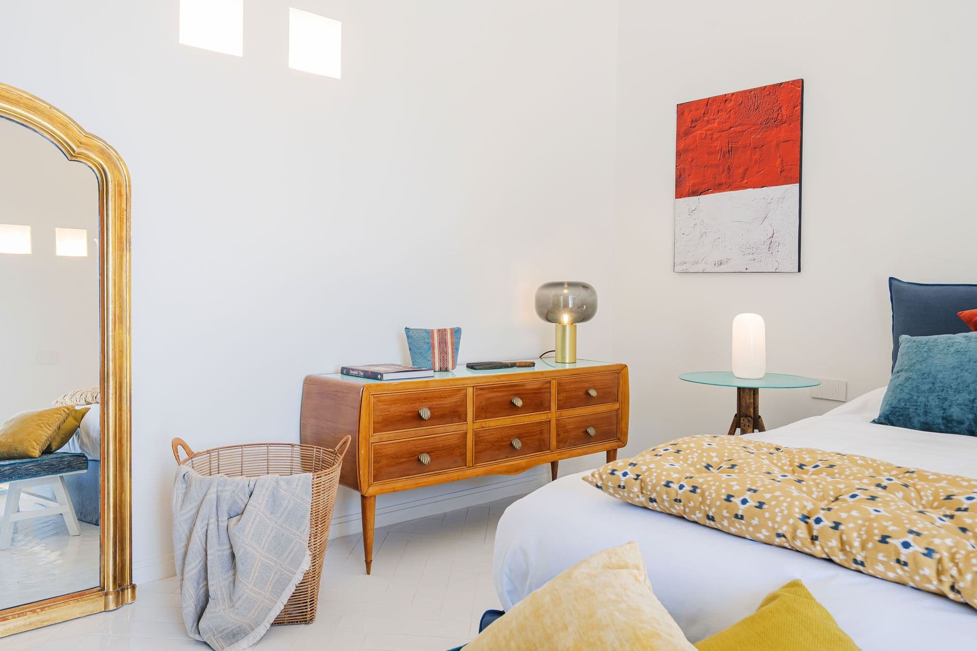 Bedroom with vintage mirror and mid-century dresser at Ocean House, Positano