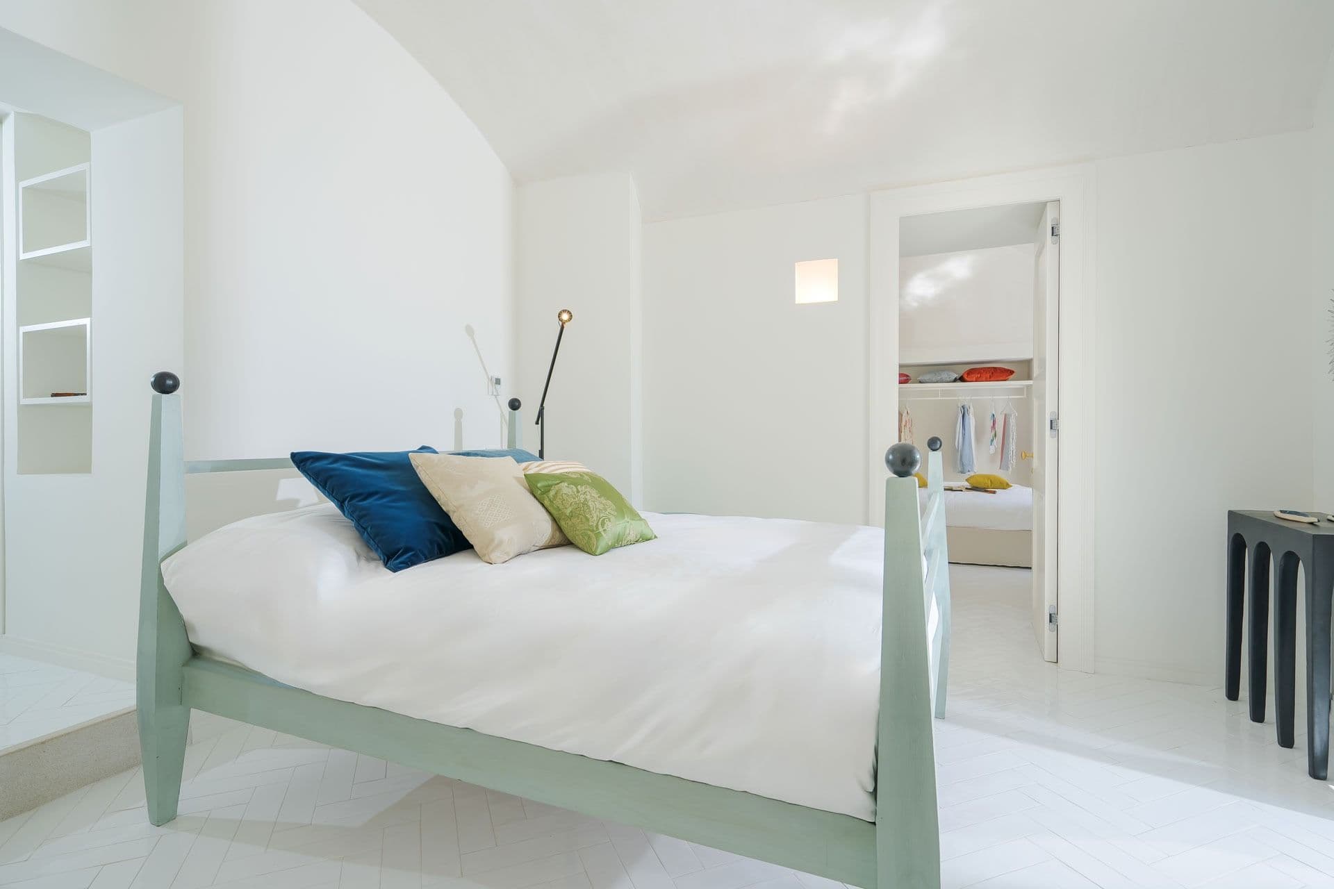 Bedroom with sage green bed frame at Ocean House, Positano
