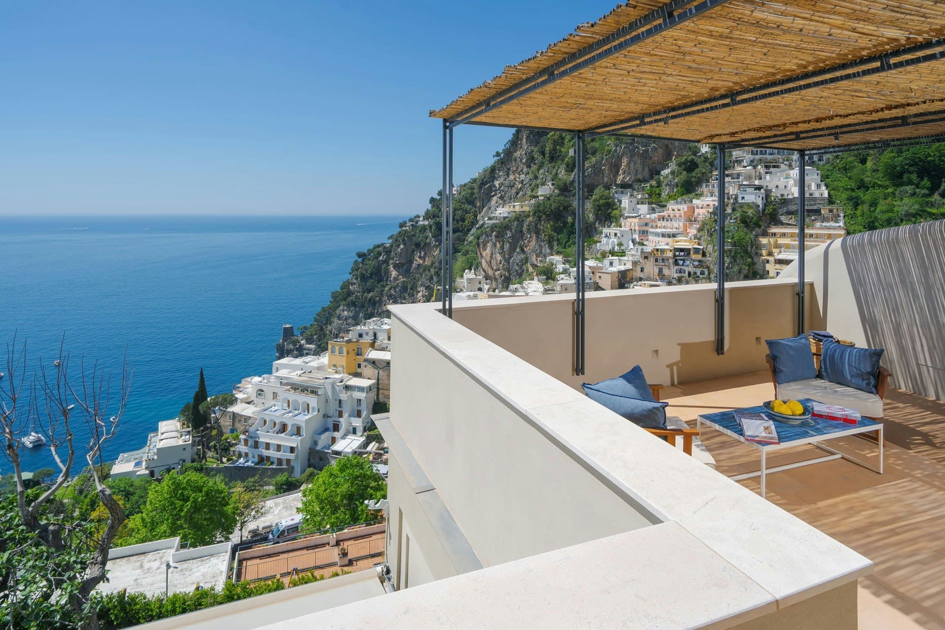 Ocean House rooftop terrace with bamboo pergola overlooking Positano, Amalfi Coast, Italy