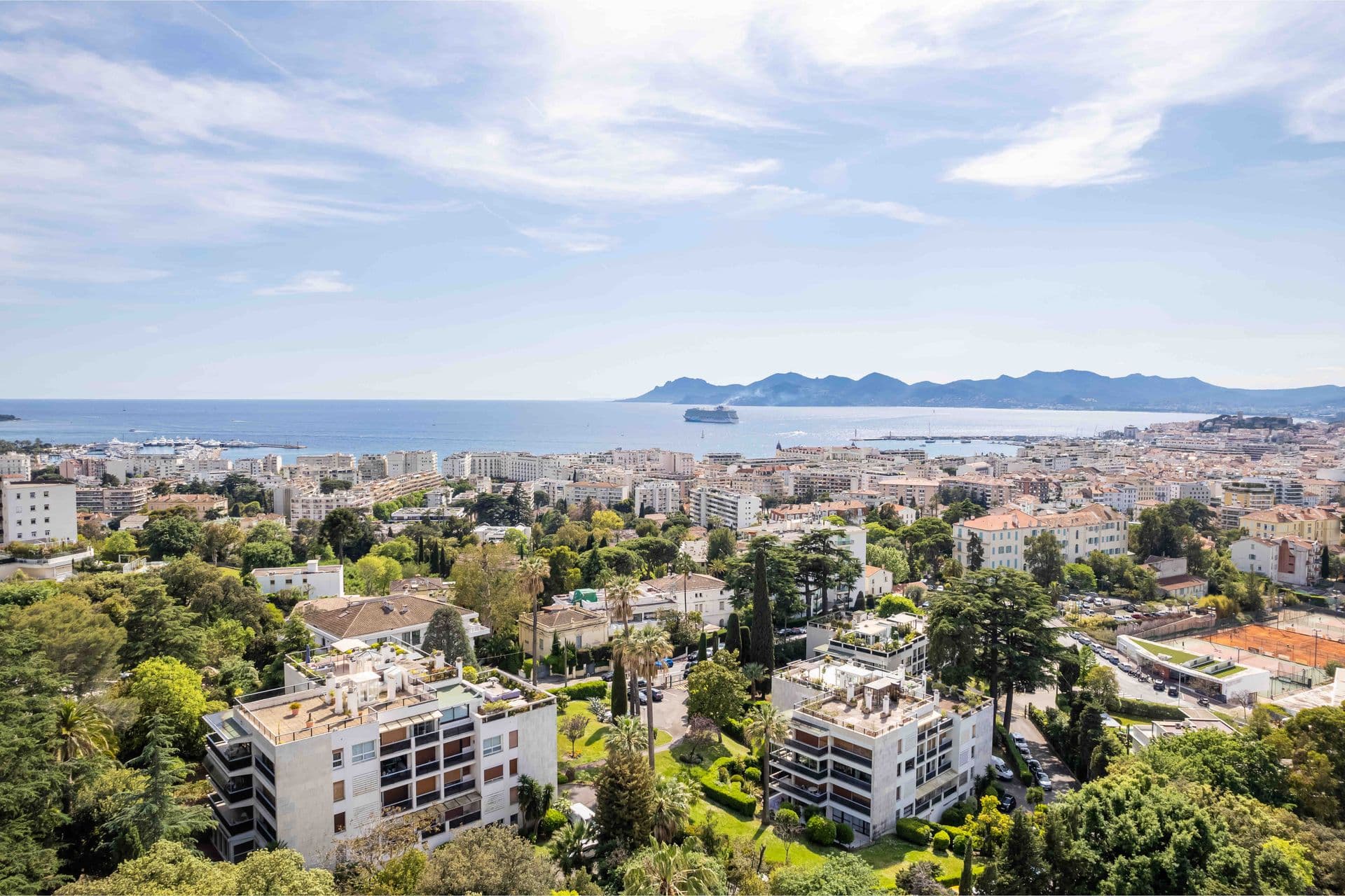 A panoramic aerial view over Cannes towards the sea and Lerins Islands from the villa