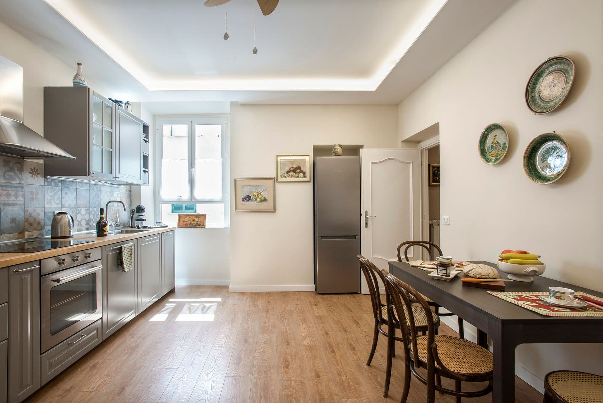 Kitchen with dining table and wall-mounted plates