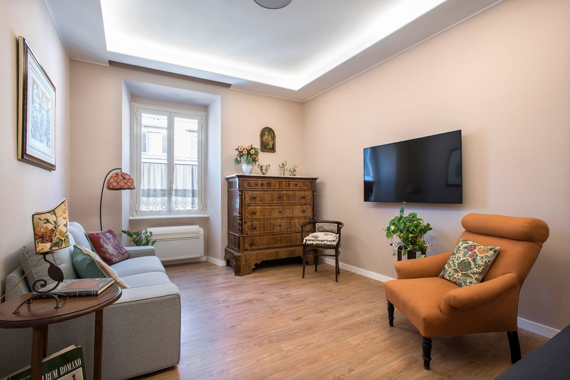 Lounge with sofa, armchair and television
