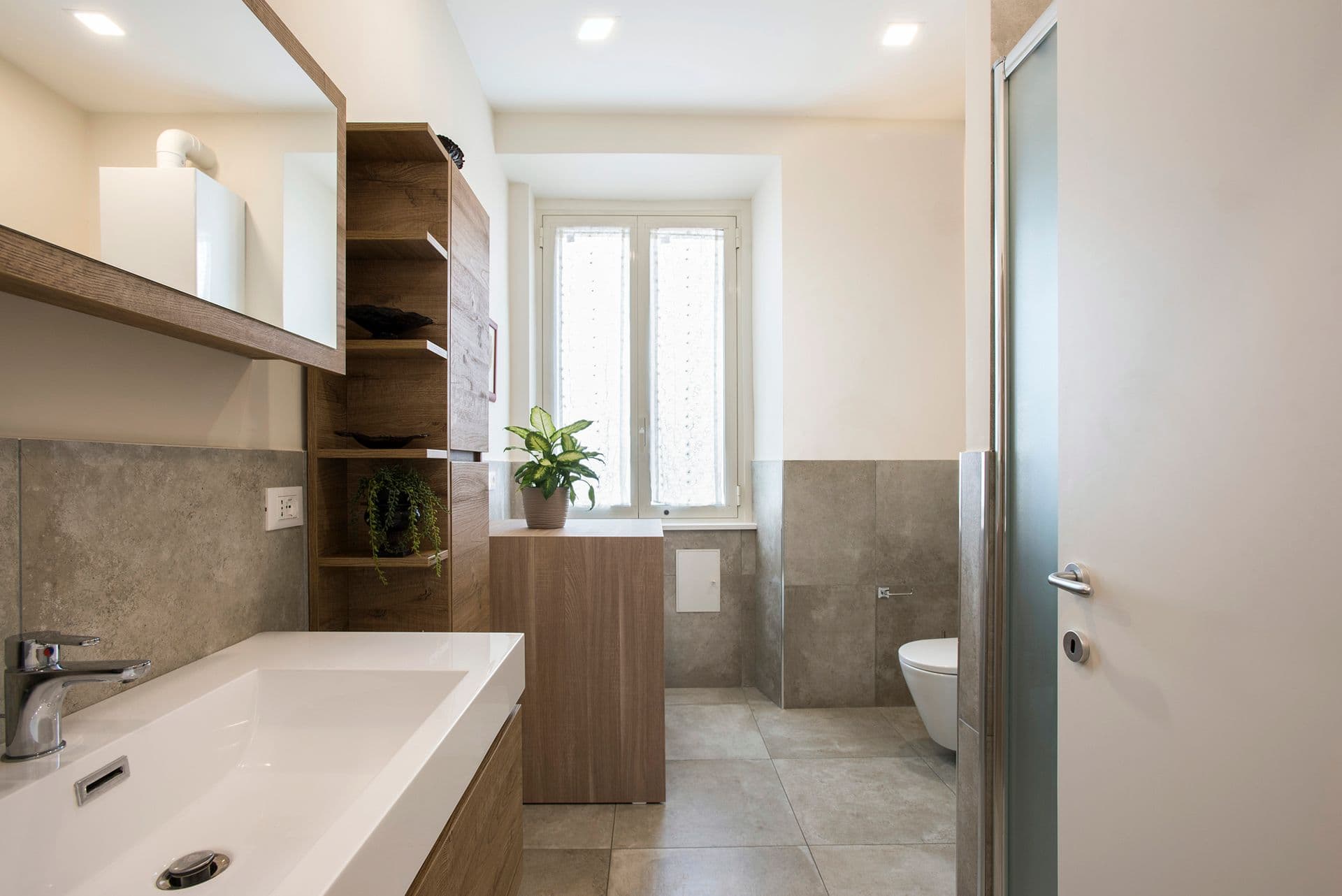 Second bathroom with wood-effect vanity and walk-in shower