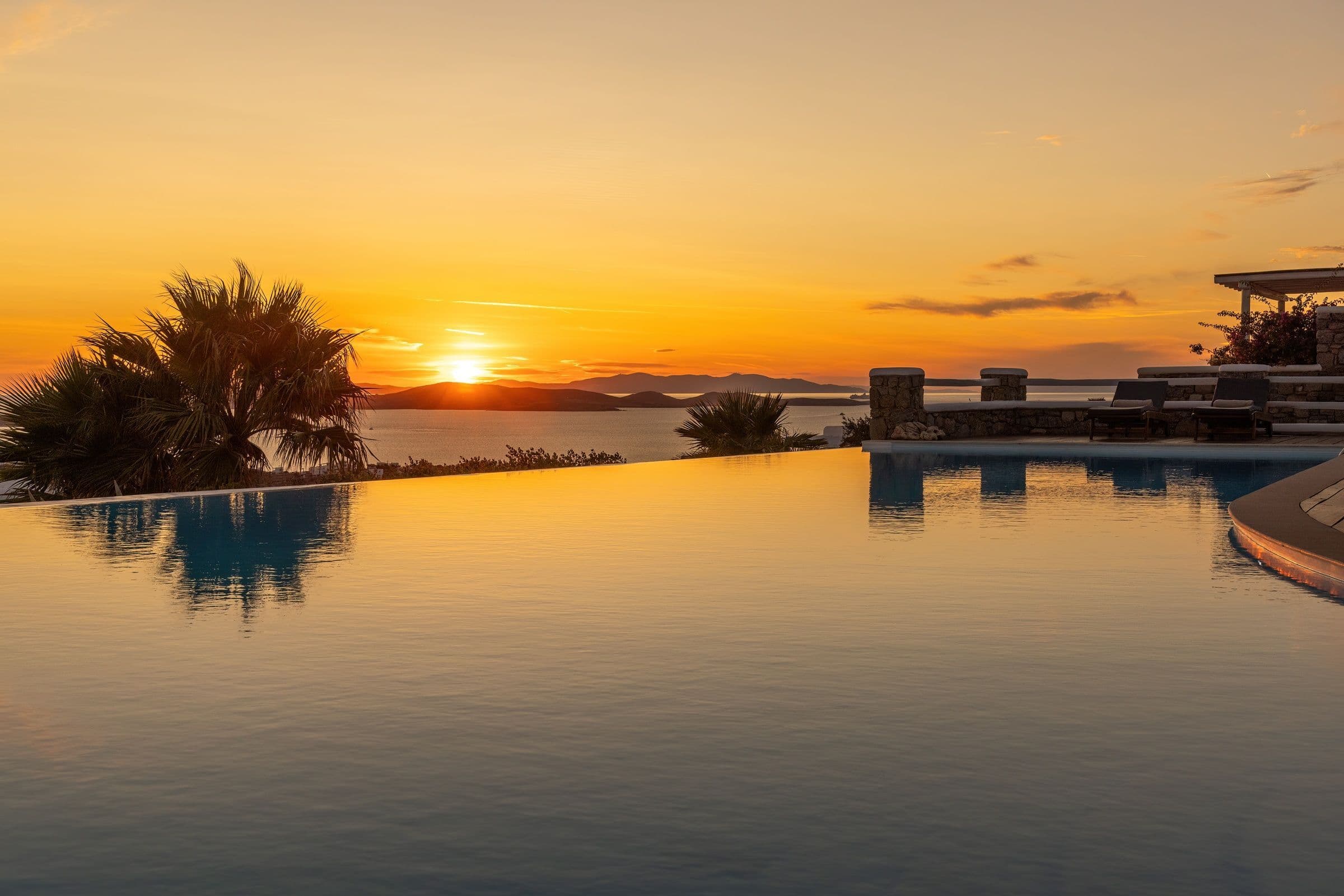 Villa Infinite Breeze sunset view over infinity pool, Mykonos, Cyclades Islands, Greece