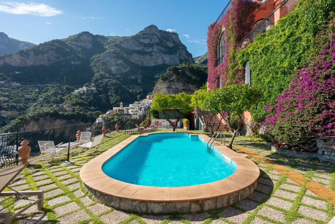 Terracotta Positano villa with a pool set against dramatic coastal mountains