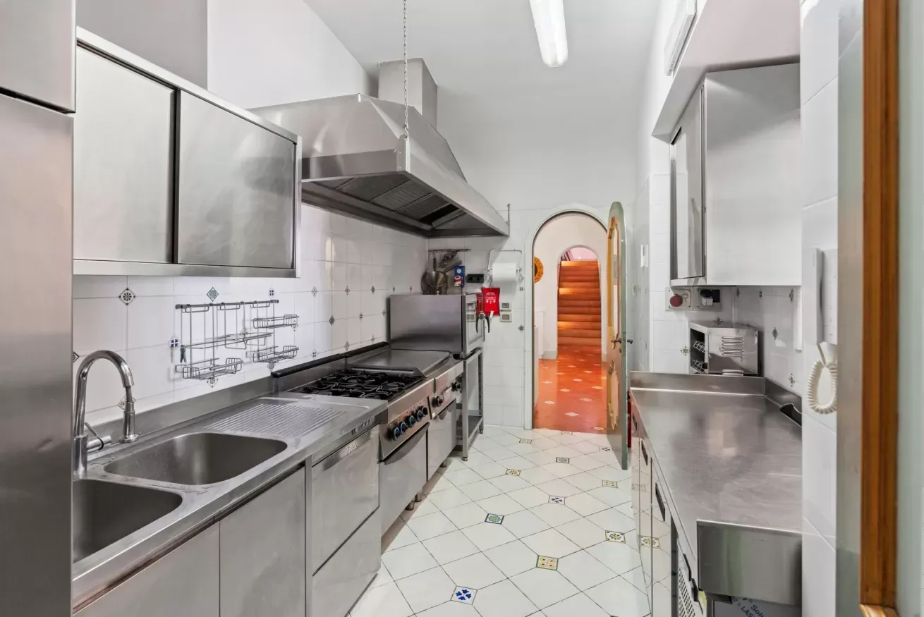 Professional stainless steel kitchen with gas range
