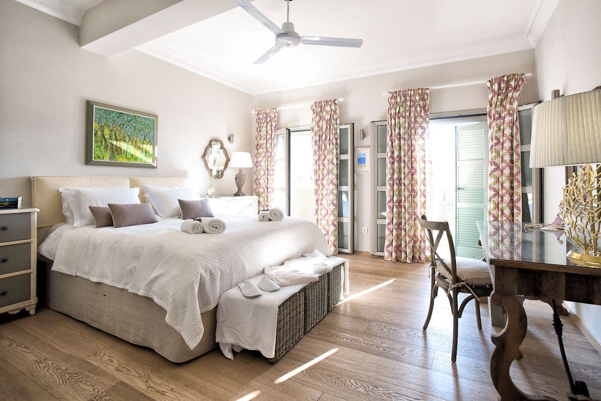 Villa Pearl master bedroom with skylight and coastal furnishings, Kassiopi, Greece