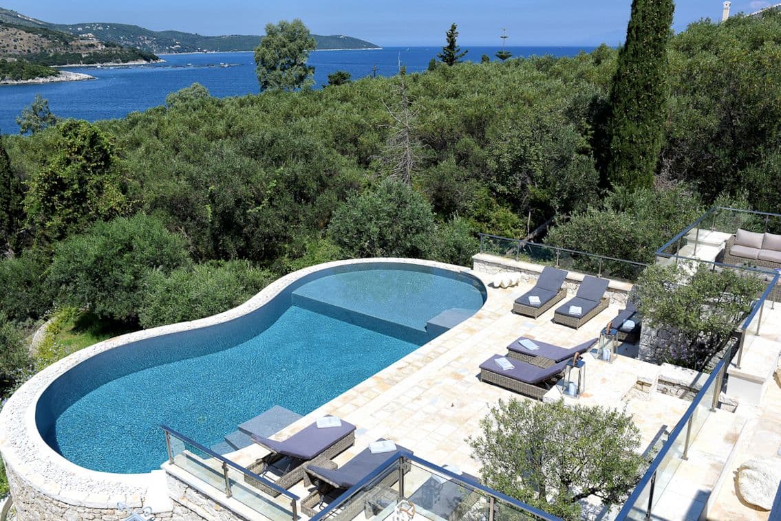 Villa Pearl infinity pool aerial view with Mediterranean gardens, Kassiopi, Greece