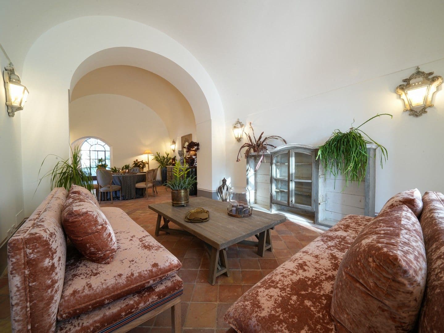 Vaulted living room with crushed-velvet sofas and terracotta floors at Casarlano Sunsets, Sorrento