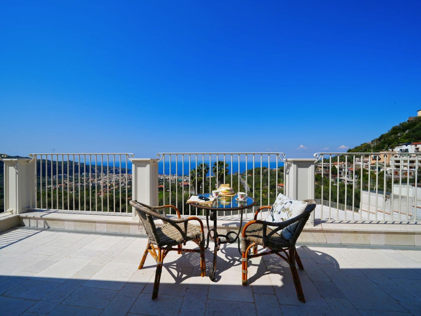 Terrace with a bistro table overlooking the Bay of Naples at Casarlano Sunsets, Sorrento