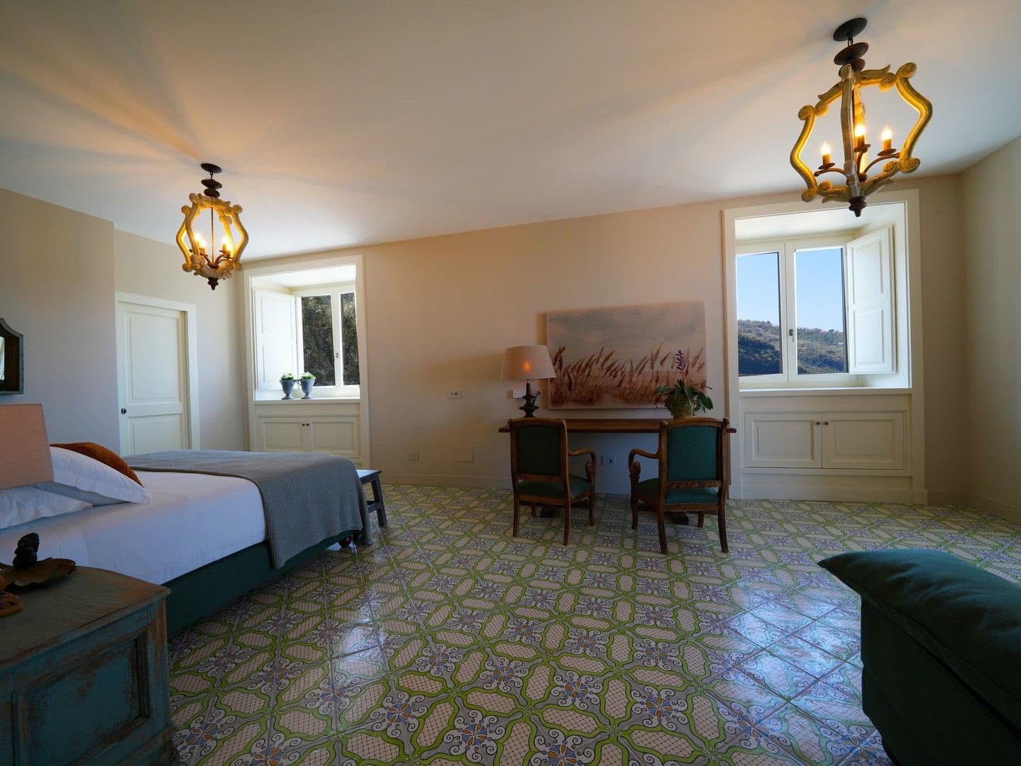 Twin bedroom with a writing desk and majolica-tiled floor at Casarlano Sunsets, Sorrento