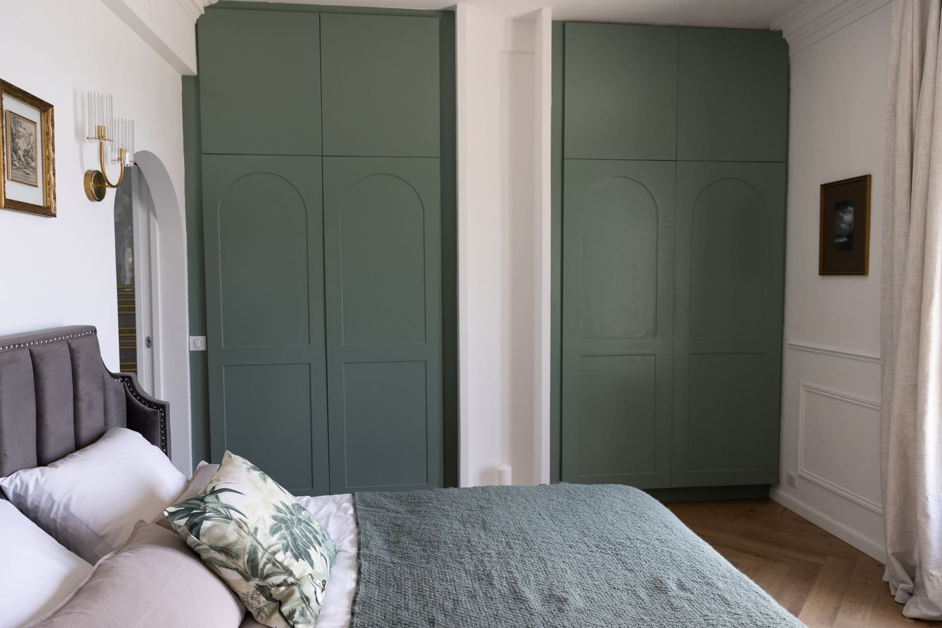 Double bedroom with a grey bed and sage-green wardrobes at Cote D'Azur Sunshine, Antibes
