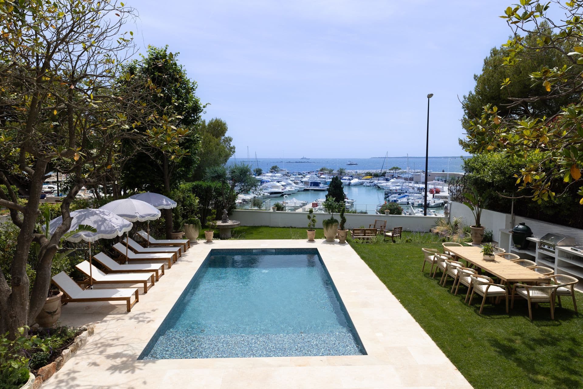 Pool and sun loungers looking over the marina and yachts at Cote D'Azur Sunshine, Antibes