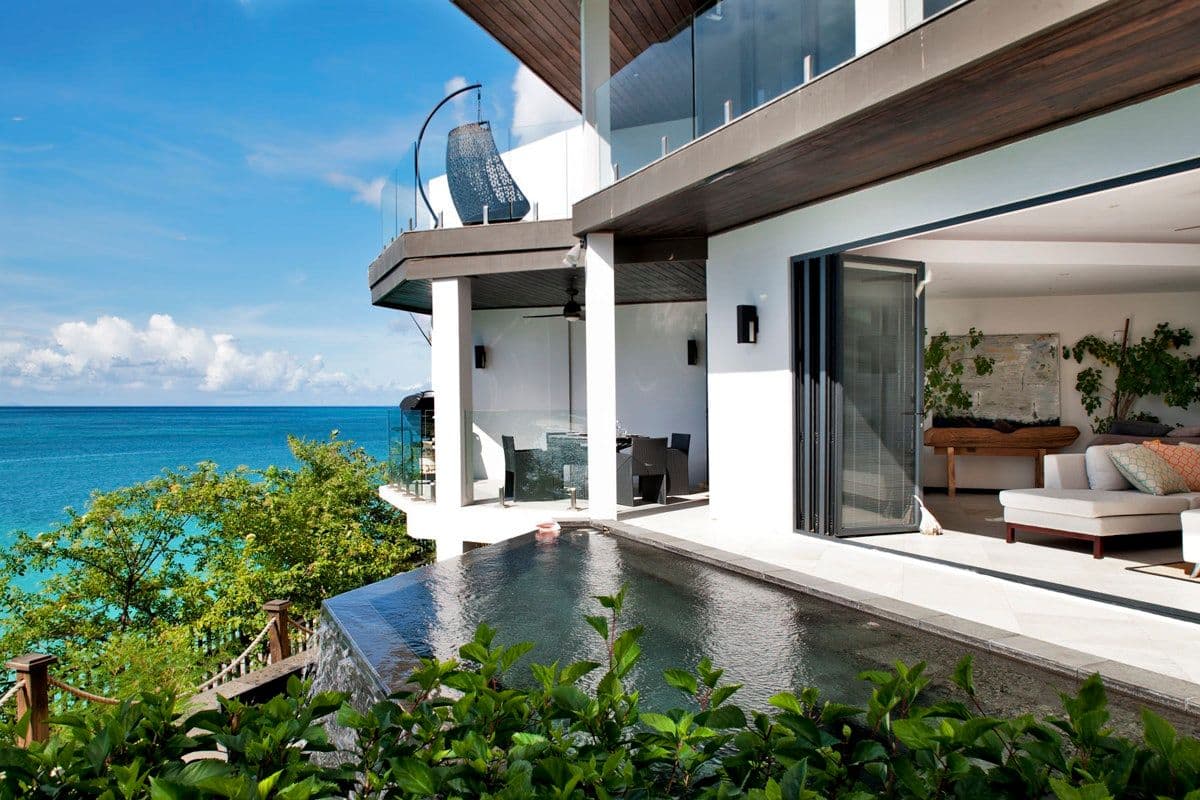White villa with an infinity pool set above the sea at Views in the Tropics, Antigua