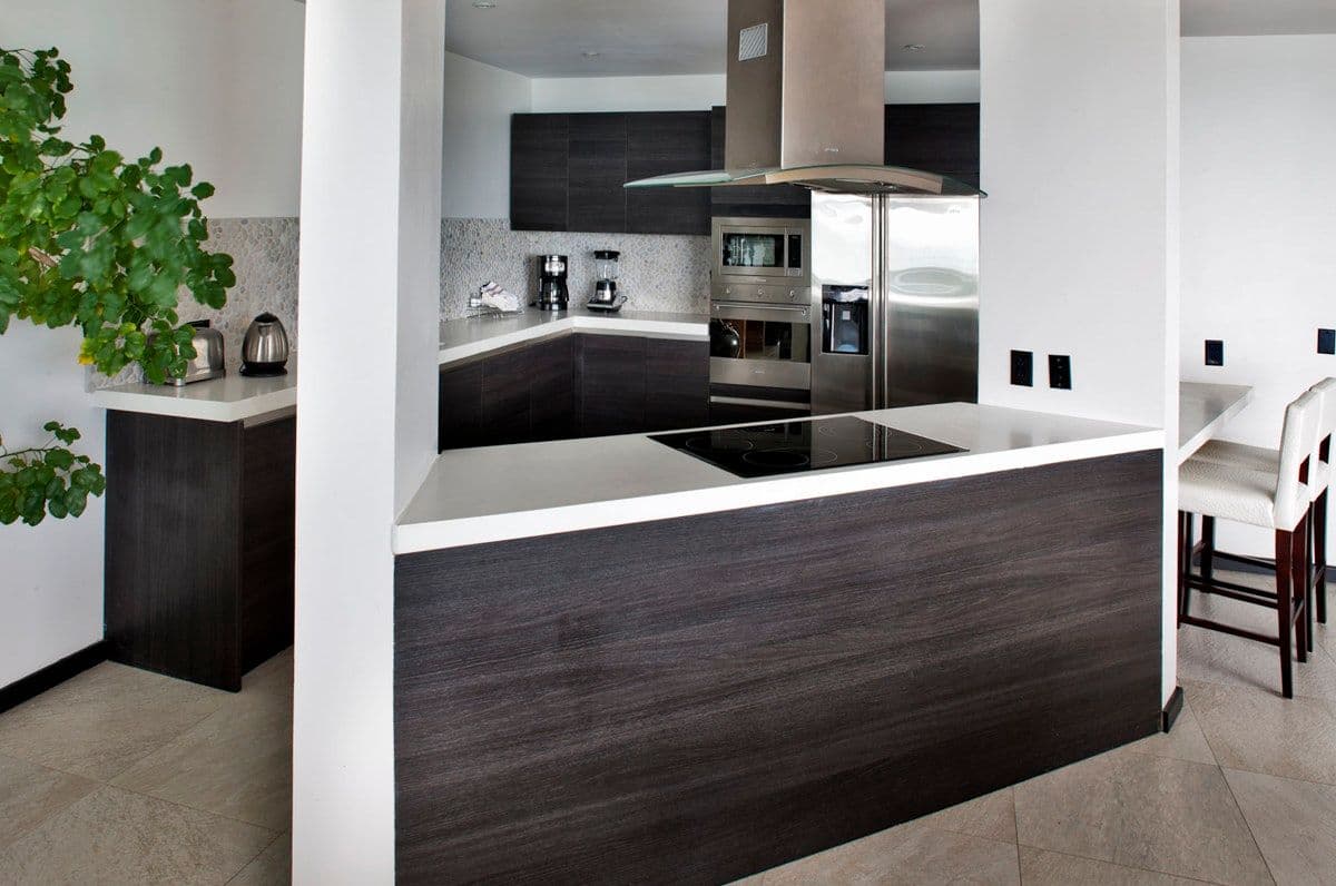 Kitchen with an island and breakfast bar at Views in the Tropics, Antigua