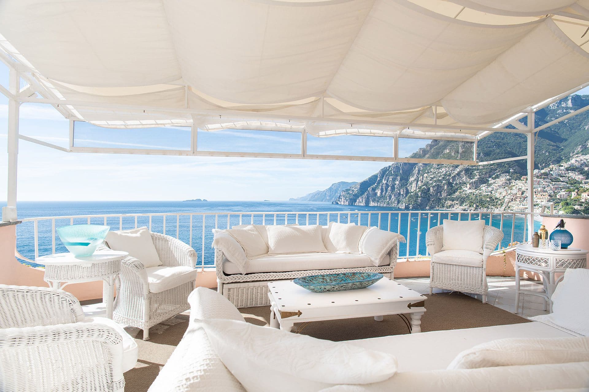 Covered terrace lounge at The Sunlit Cliff with panoramic views along the Amalfi coastline