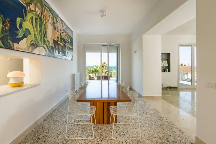 Sicilian Song dining area with kitchen view, Fontane Bianche, Sicily, Italy
