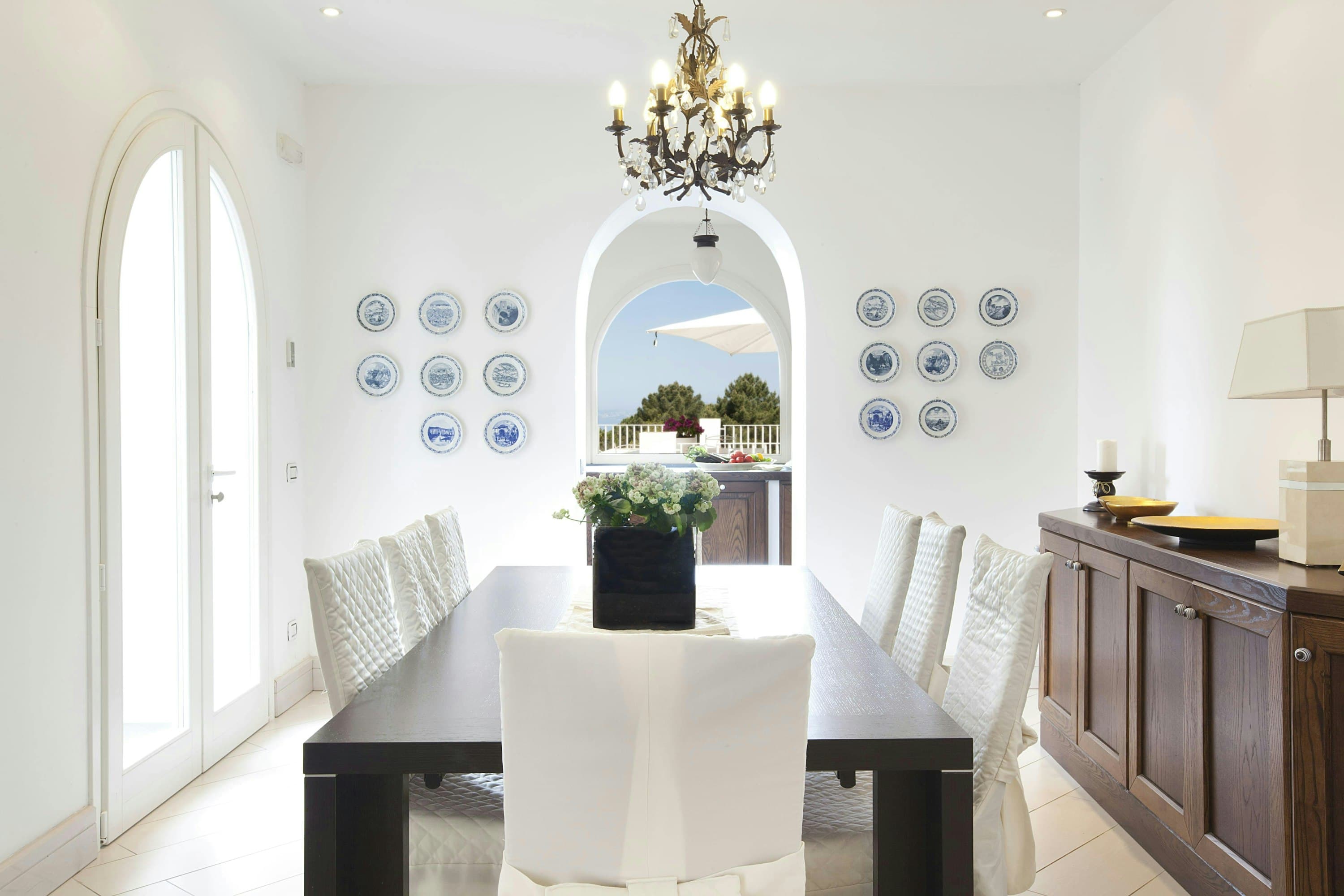 The Italian Pearl formal dining room with chandelier and sea views, Sorrento, Amalfi Coast, Italy