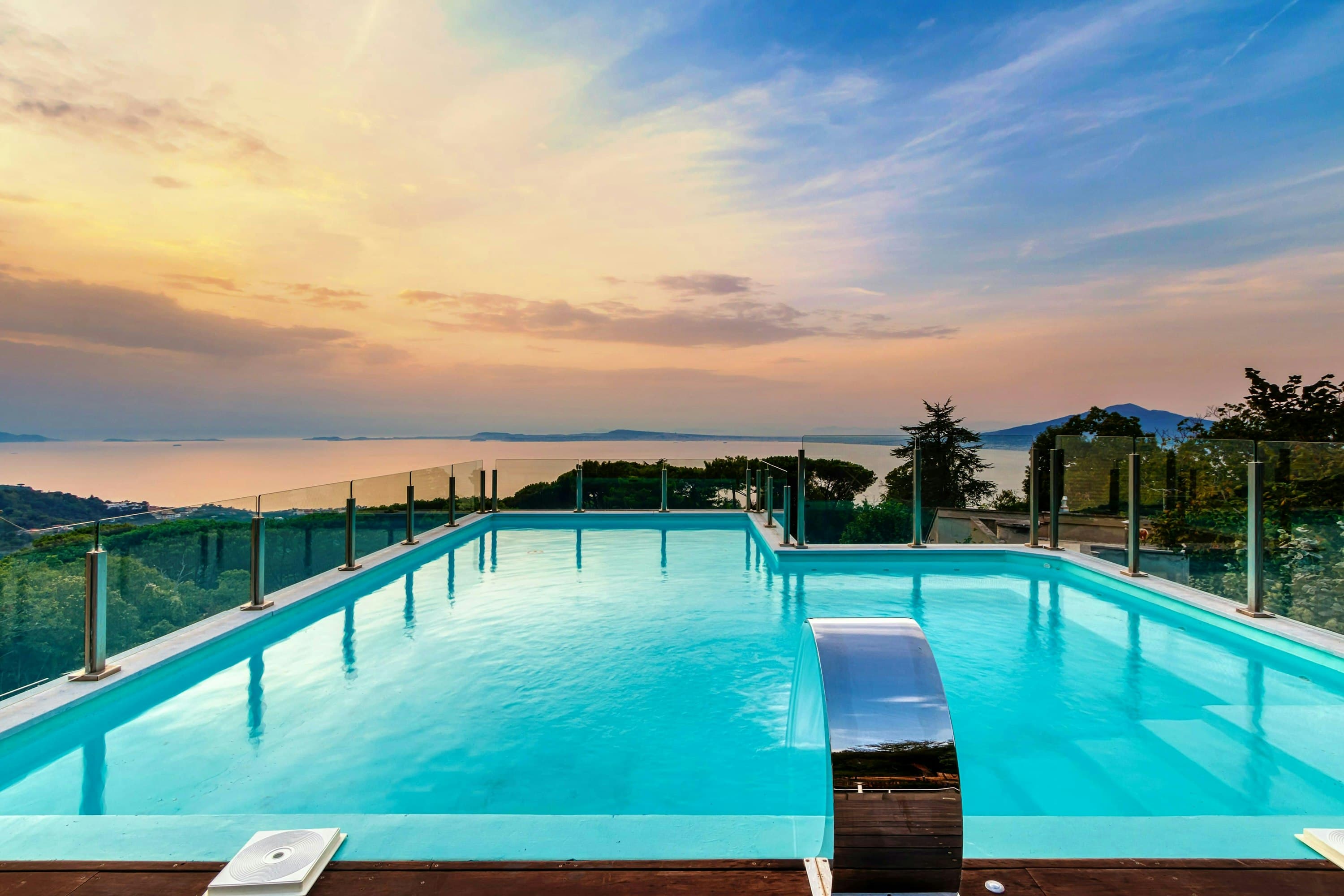 The Italian Pearl infinity pool with waterfall feature overlooking Bay of Naples, Sorrento, Italy