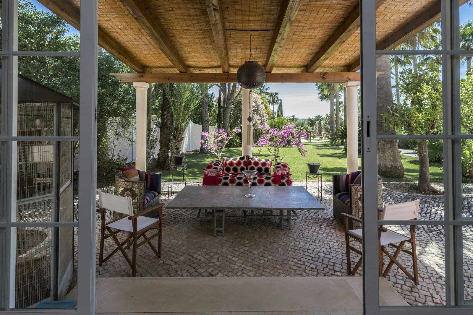 Your Algarve Oasis covered terrace with bamboo ceiling and dining area, Loulé, Portugal