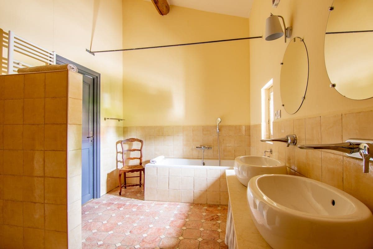 Bathroom with freestanding tub and twin sinks