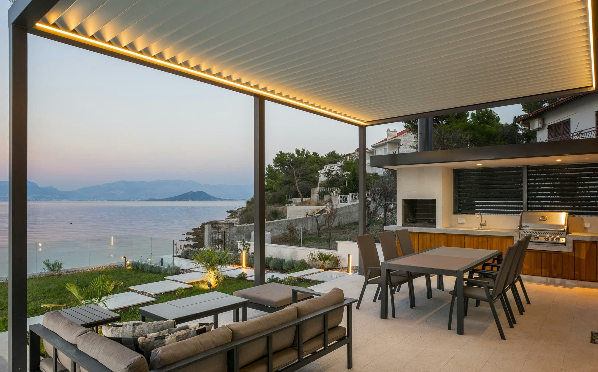 Shades of Summertime covered terrace with outdoor kitchen at sunset, Slatine, Dalmatian Coast, Croatia